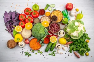 A vibrant array of fresh fruits and vegetables spread, including tomatoes, broccoli, lemons