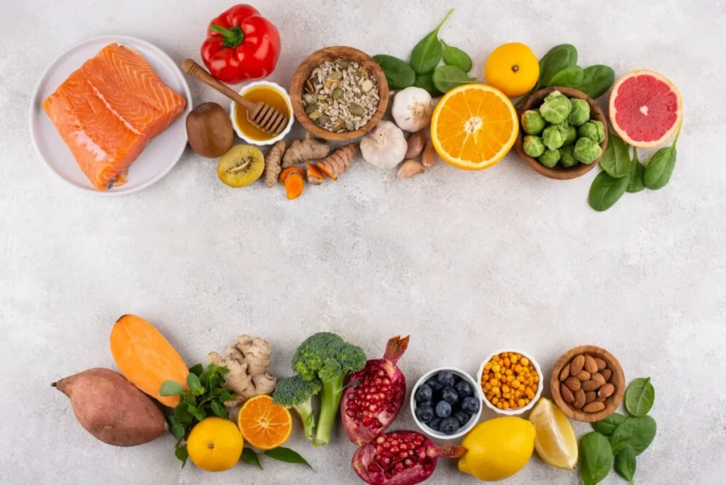 Assorted healthy foods including fruits, vegetables, nuts, and salmon